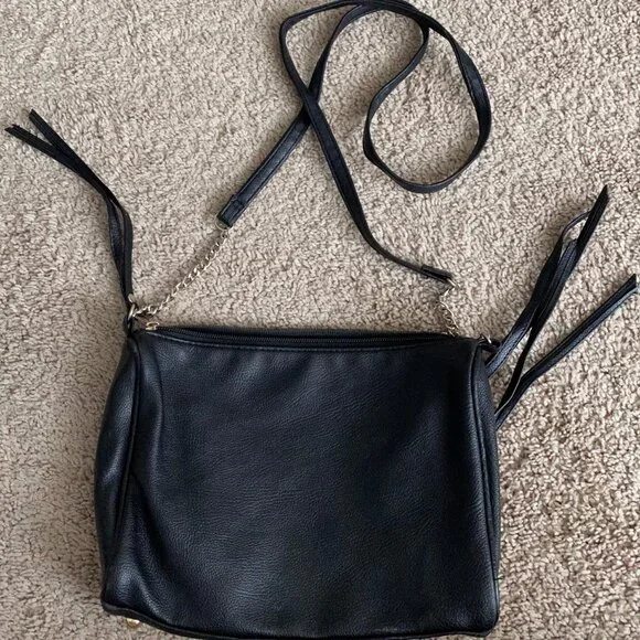 Black leather crossbody bag with gold zippers and hardware. - Picture 3 of 3